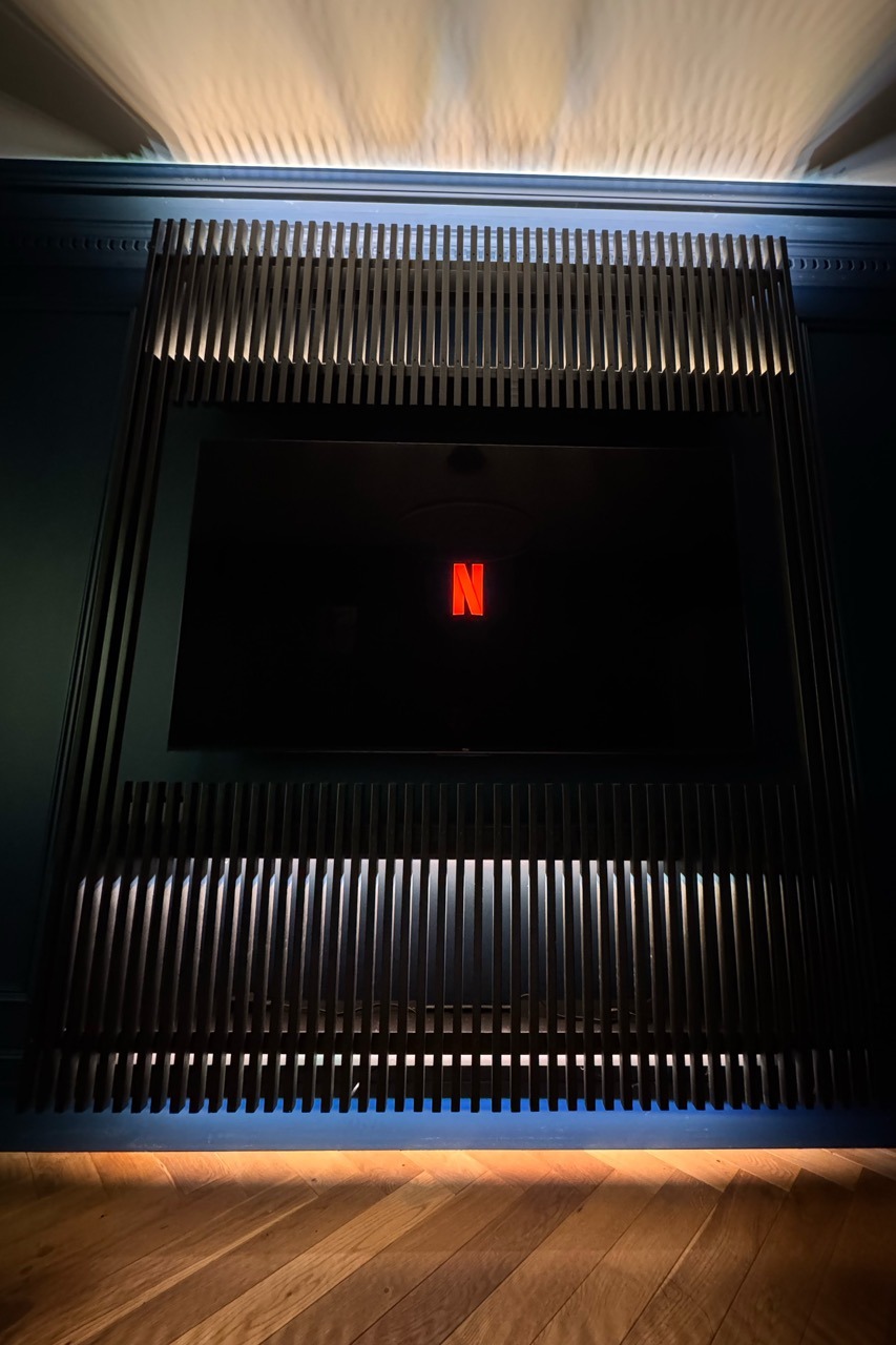 Custom TV wall — angled view with LED edge lighting